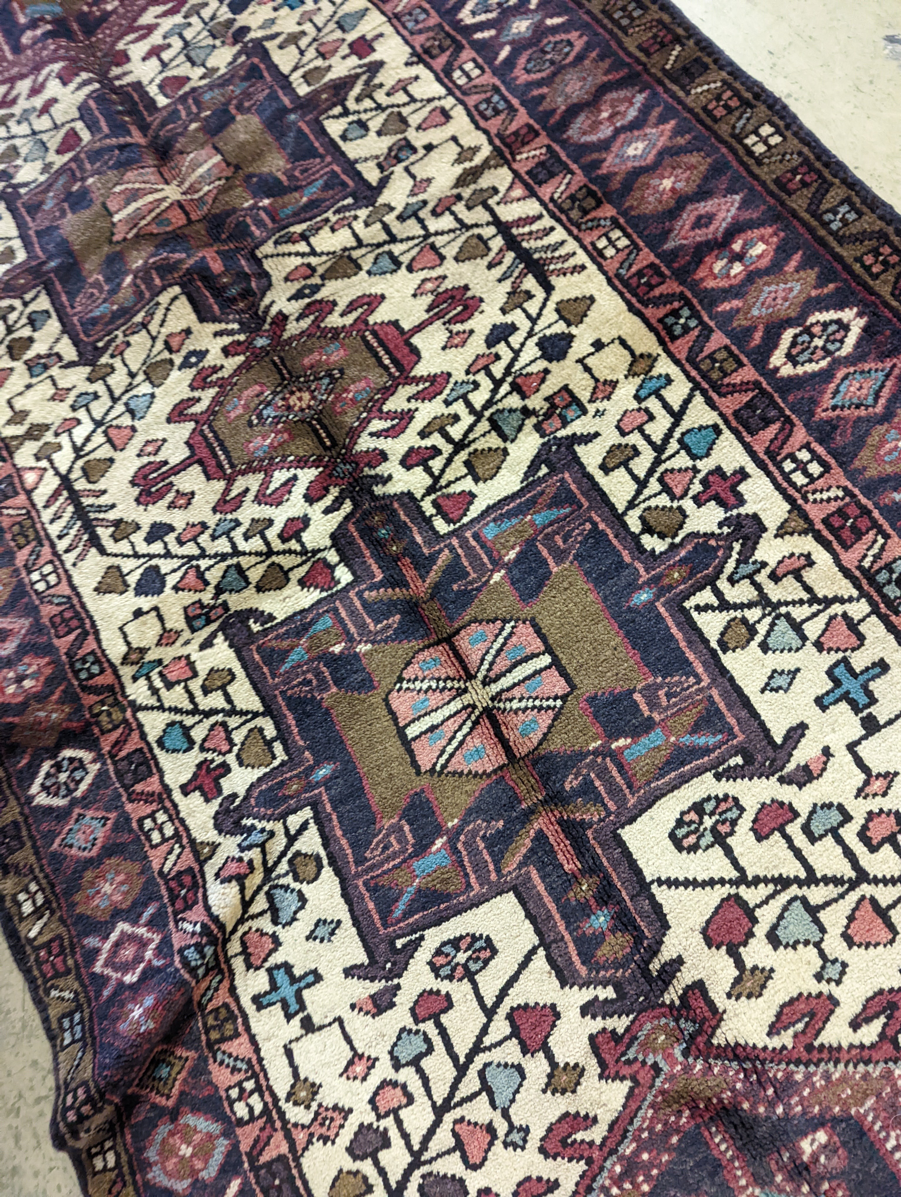 A Karajeh hall carpet, 320 x 106cm